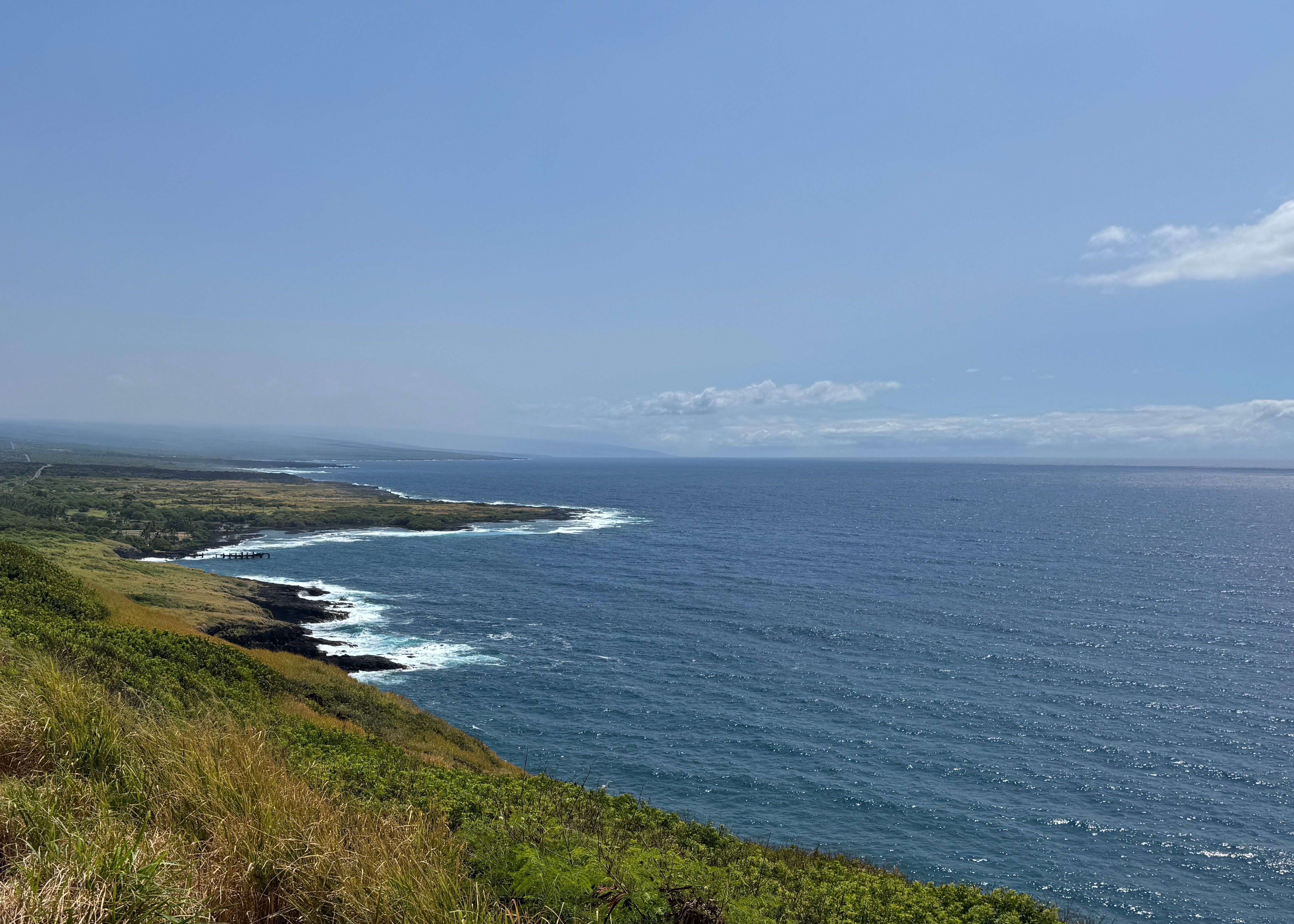pic of a beautiful ocean scene along a highway.